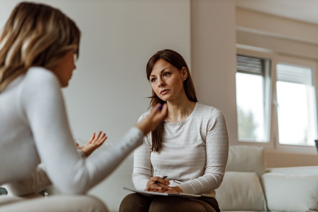 woman discussing bipolar disorder struggles to her therapist