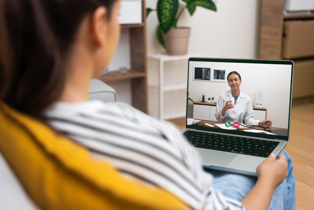 woman meeting with therapist virtually