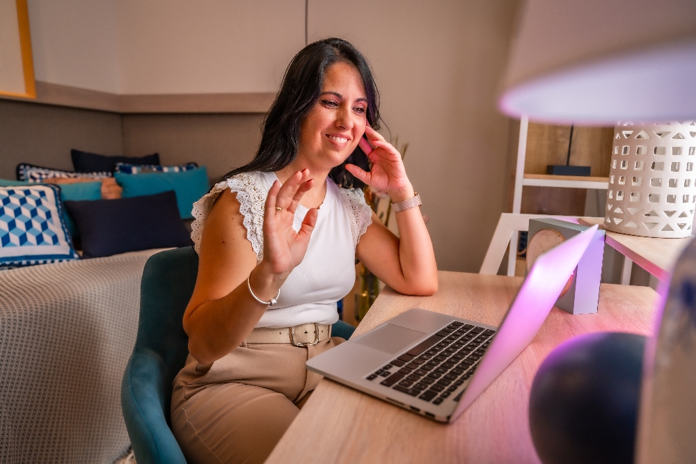 woman meeting with therapist on zoom call virtual iop addiction treatment