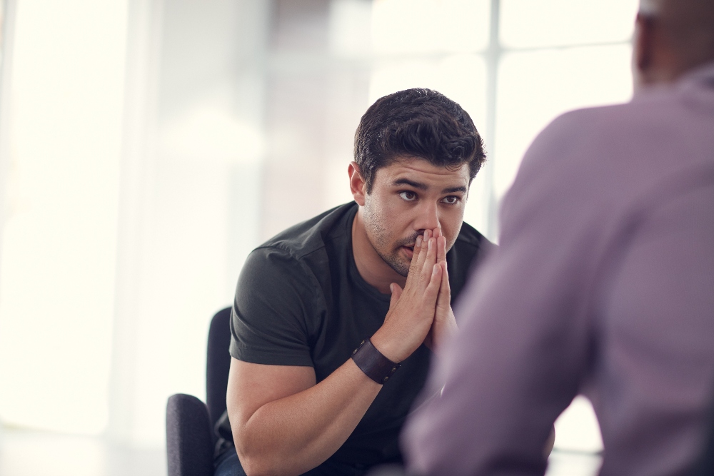 man with ocd speaking to therapist in los angeles