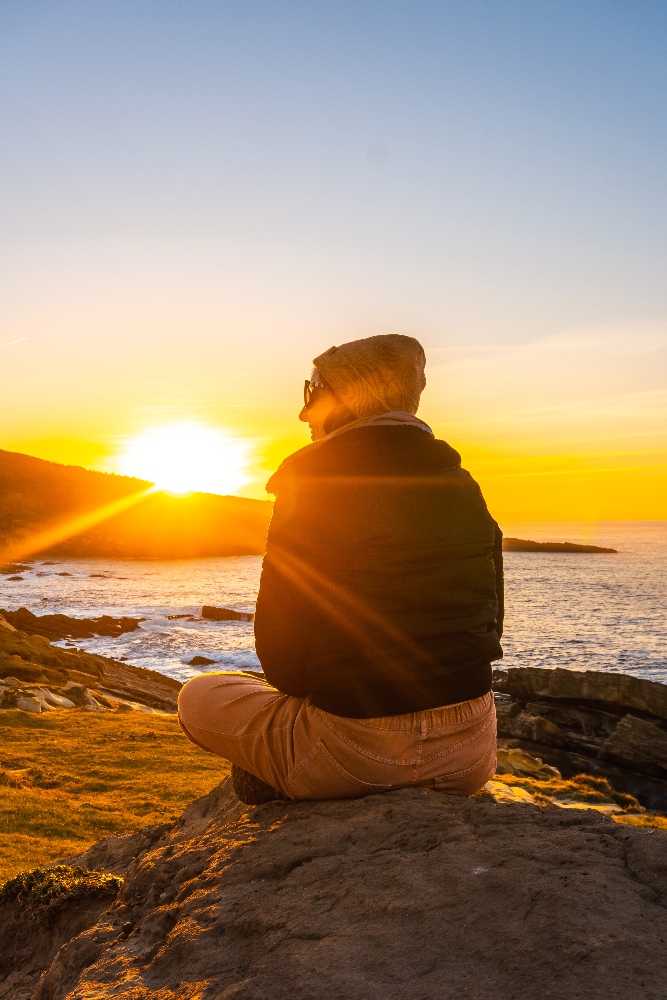 woman watching sunset