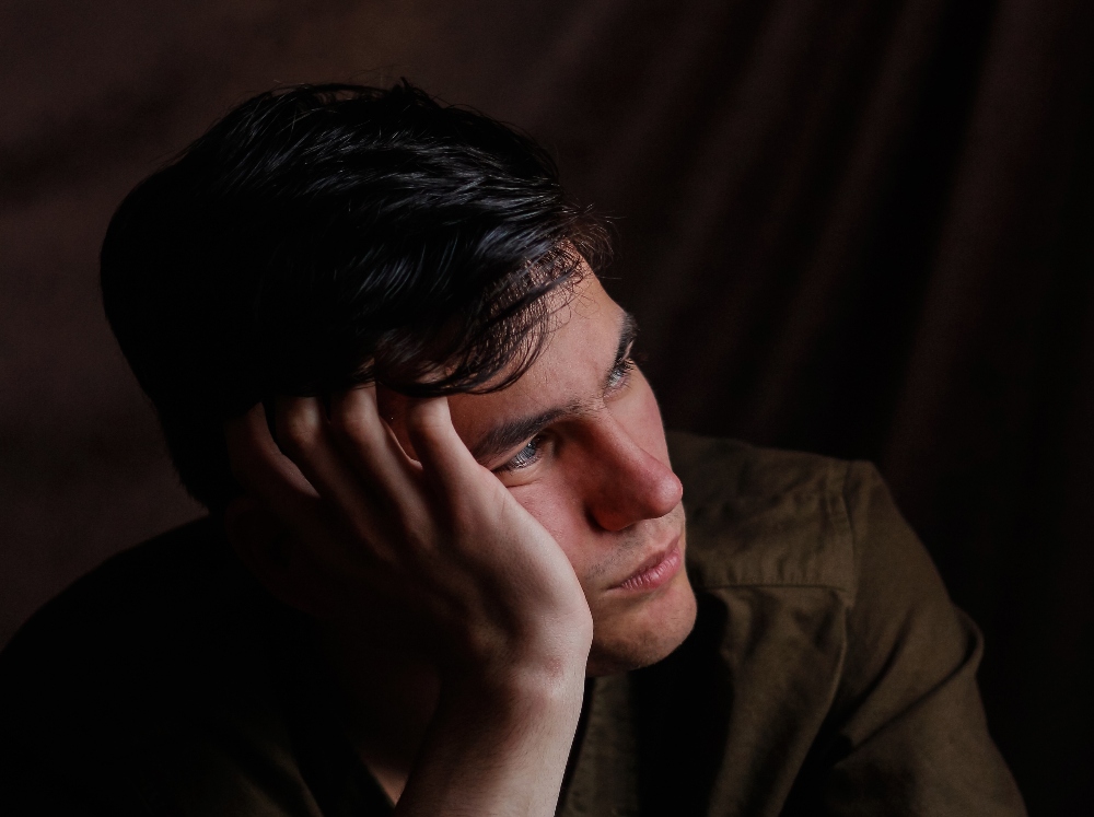sad man struggling with trauma